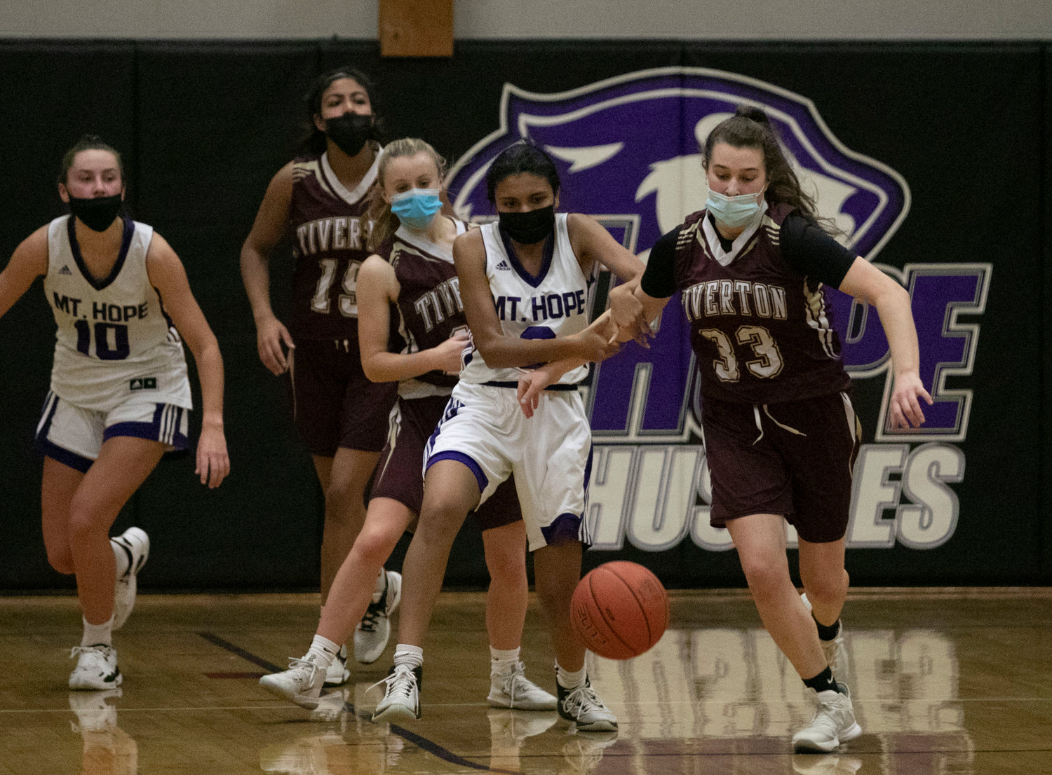 Abby Monkevicz (right) fights for a loose ball with Mt. Hope's Aditi Mehta. 