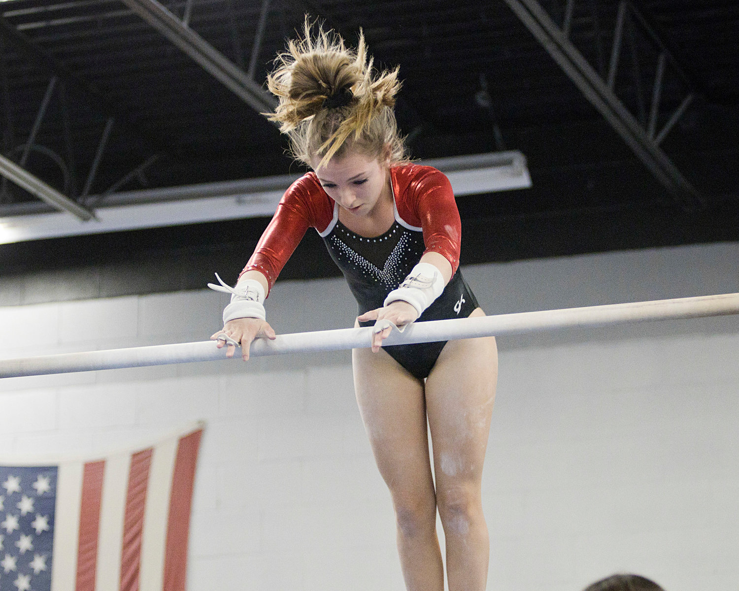 Payton Brearley grabs onto the high bar while competing during the Saturday, Jan. 22, meet against Portsmouth, Middletown, and Mt. Hope.