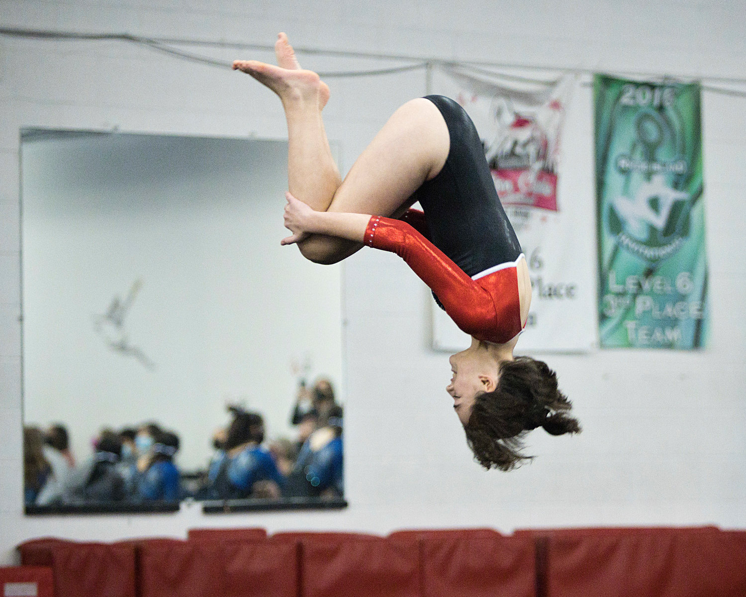 Carter Bessette-Warwick completes her floor exercise during the Saturday, Jan. 22, meet against Portsmouth, Middletown, and Mt. Hope.