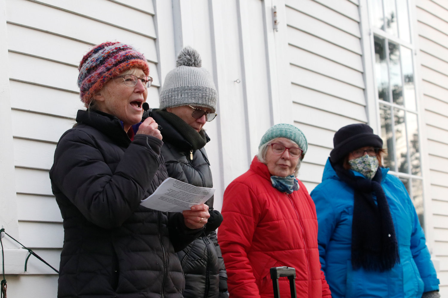 Gretchen Baker Smith (left), Pam Drouin, Susan Czernicka and Barbara Sullivan speak during the vigil. 