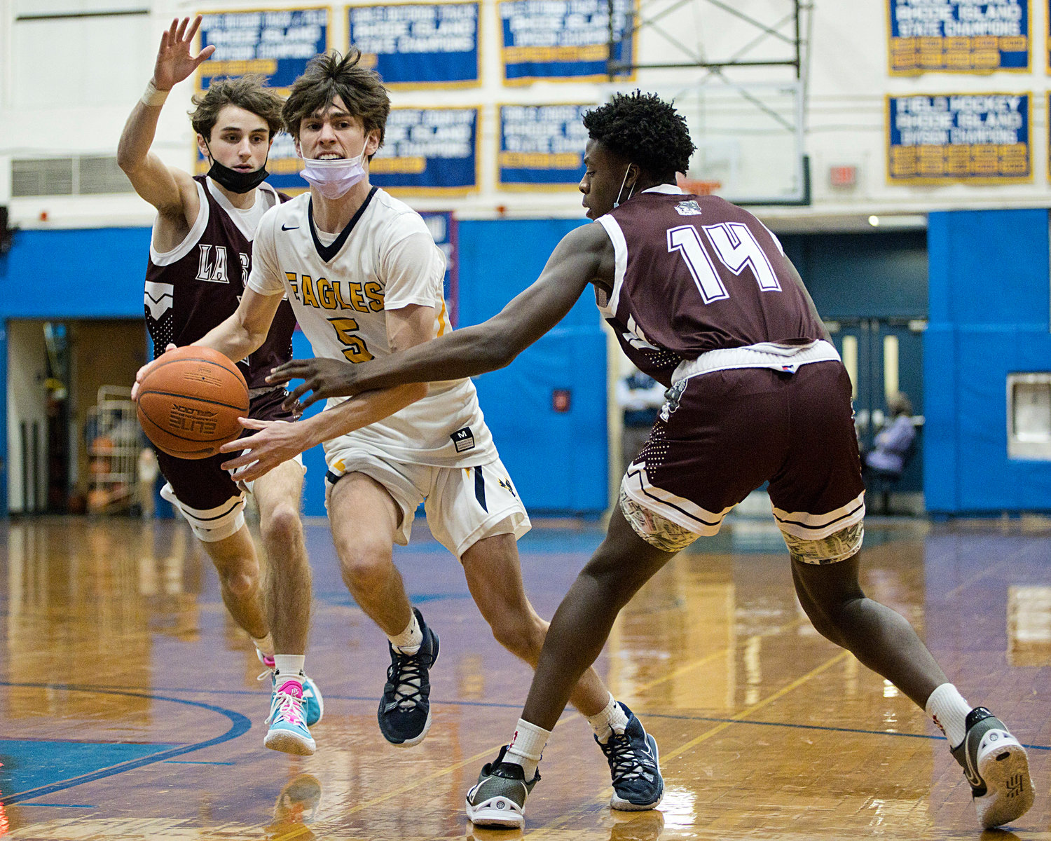 Matt Raffa looks for an opportunity while controlling the ball through a pair of LaSalle defenders.
