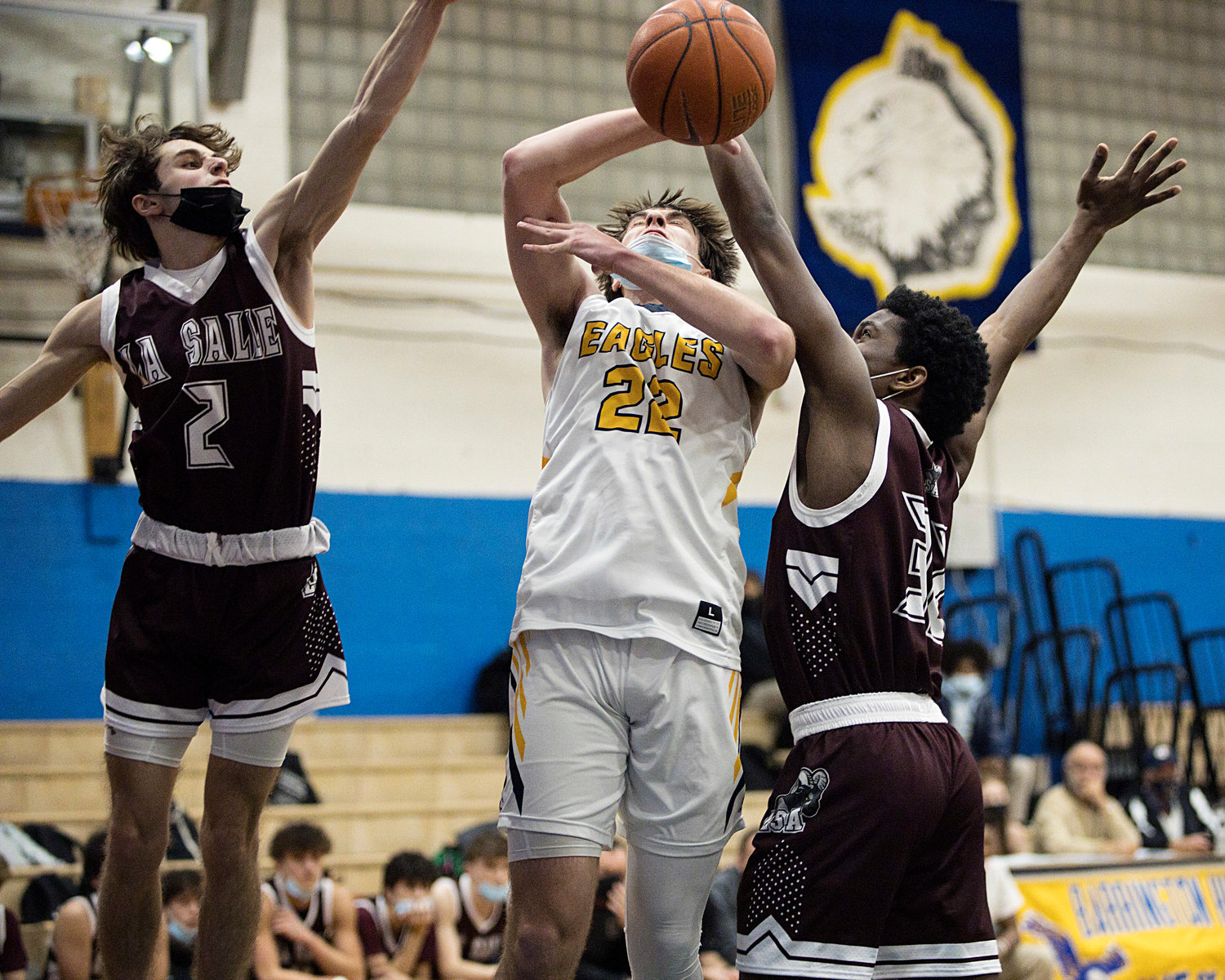 Jack Abadi loses control of the ball under the hoop, during Monday's game, against LaSalle.