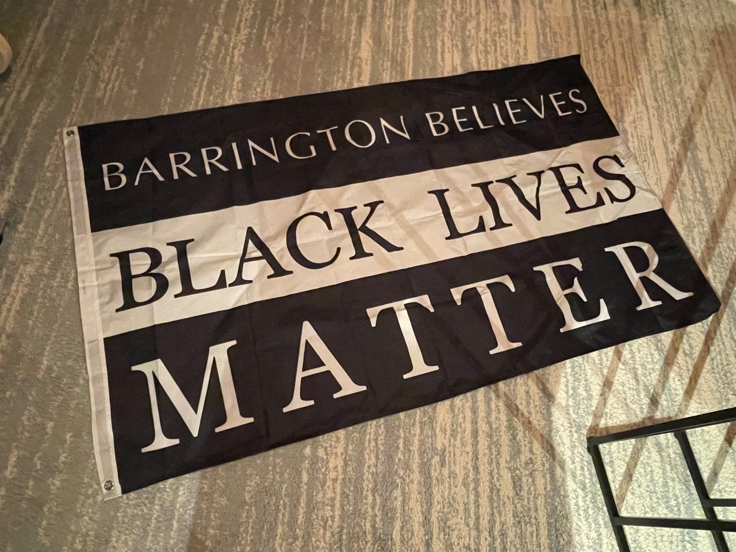Barrington Town Council member Jacob Brier made this flag, which carries the message “Barrington Believes Black Lives Matter. It is flying outside Barrington Town Hall for the month of February.