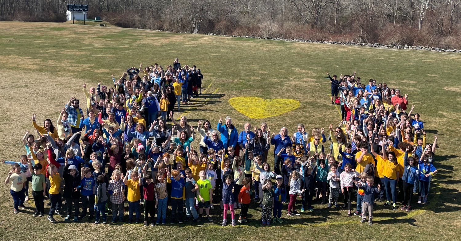 When Wilbur McMahon School fifth grade students were discussing current events in class last week, they came up with a plan to show their support for Ukraine. Last Friday, students and staff wore blue and yellow, the colors of the Ukrainian flag, and posed for a picture in the shape of a "U." Many also brought in a monetary donation that will be given to the American Red Cross Ukraine Relief Fund. As of Thursday, the effort had raised $950.
