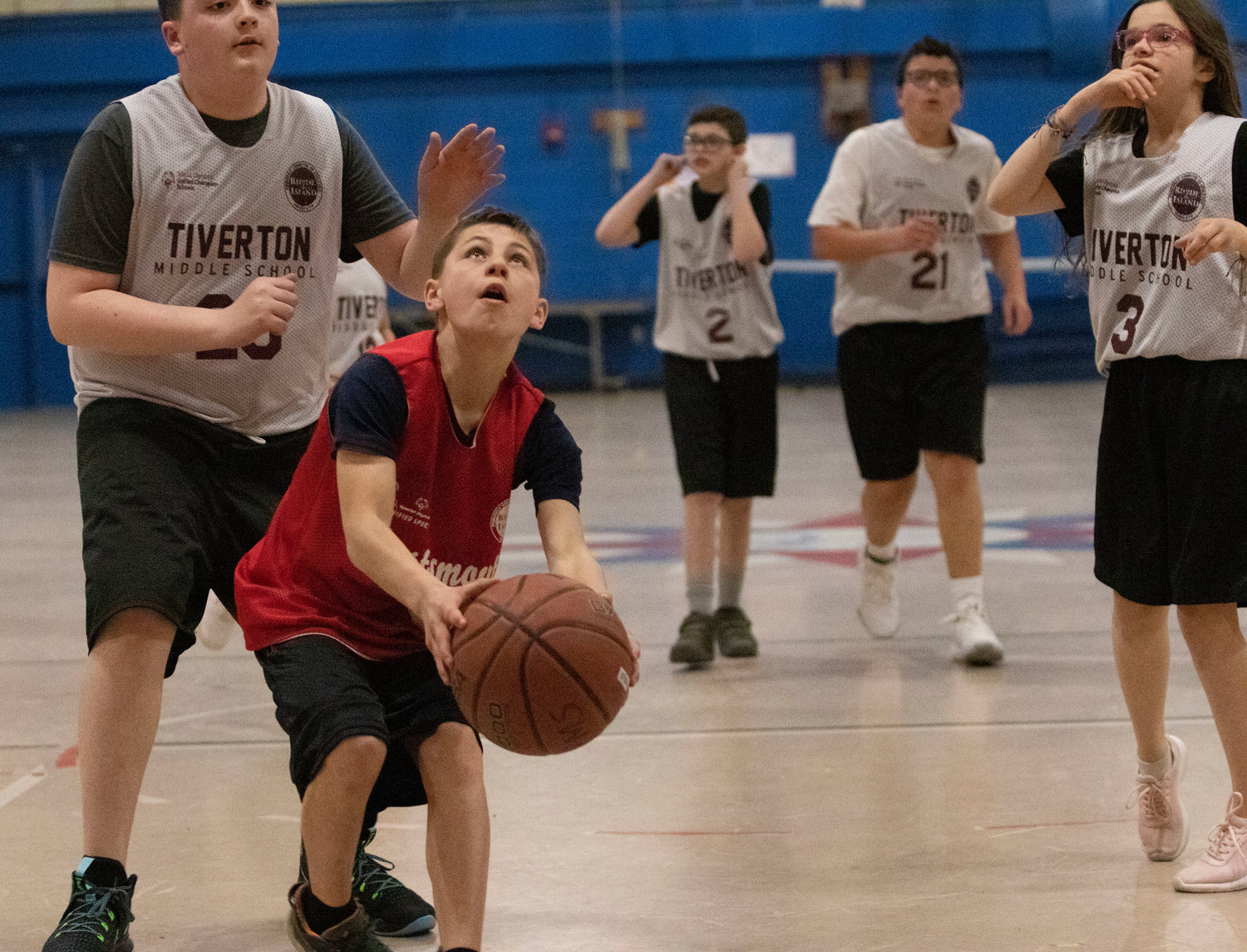 Alex Silva of the Portsmouth Middle School unified basketball team prepares to sink a jumper right before the final buzzer to give his team a 32-30 victory over Tiverton on Tuesday afternoon at home.