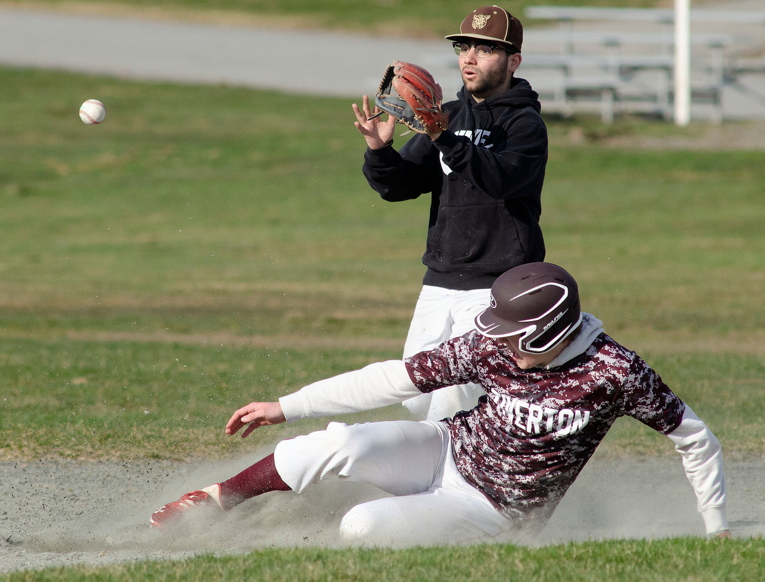 Second baseman Nick Arruda (middle) fields a throw from shortstop Noah Sowle during a scrimmage game against Tiverton on Wednesday.