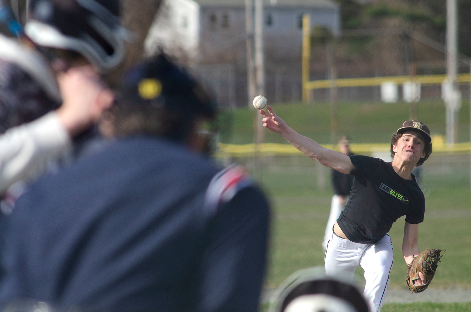 Max Gallant throws a heater during the Wildcats' home scrimmage game against Tiverton on Wednesday.