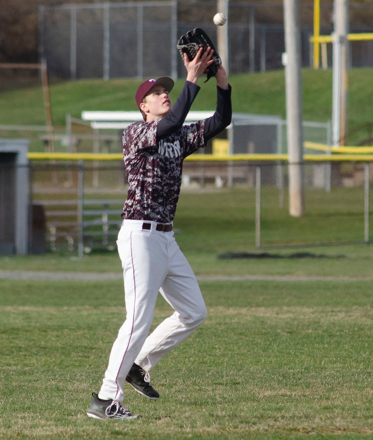 Left fielder Jason Potvin catches a flyball during the scrimmage. Potvin will be the team's ace this season.