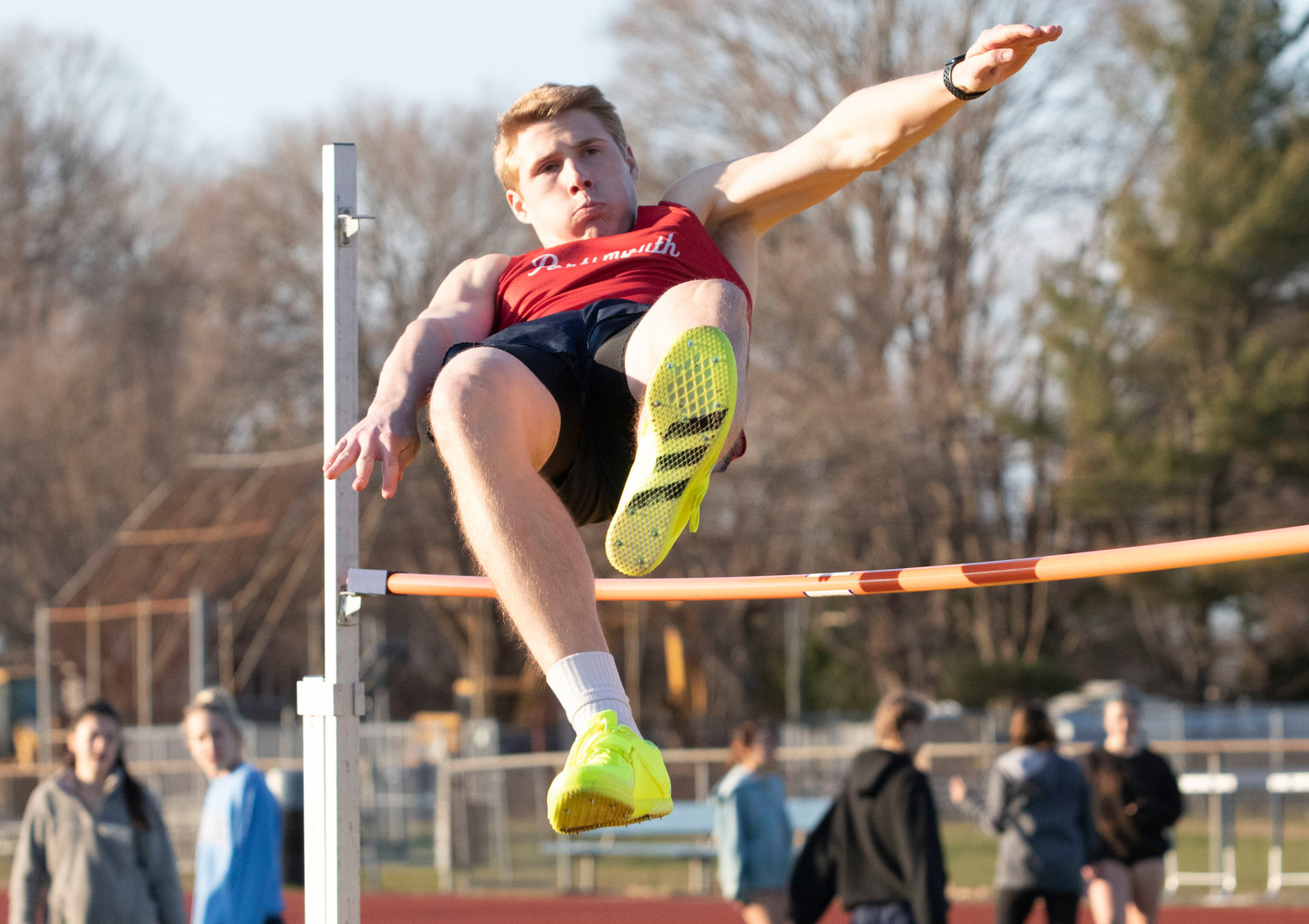 The Patriots’ Jeff Brady competes in the high jump.