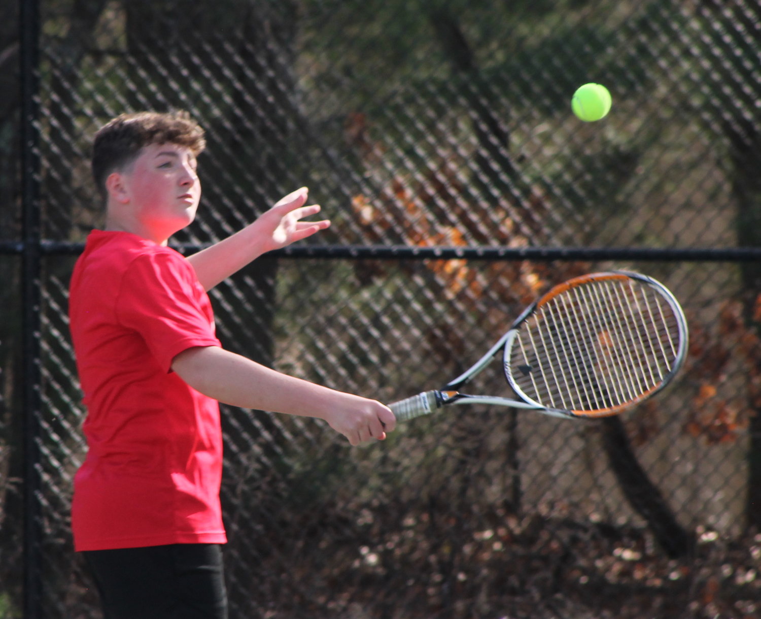 James McShane hits a backhand during his match at second singles for the EPHS boys' tennis team against Chariho Tuesday, April 12.