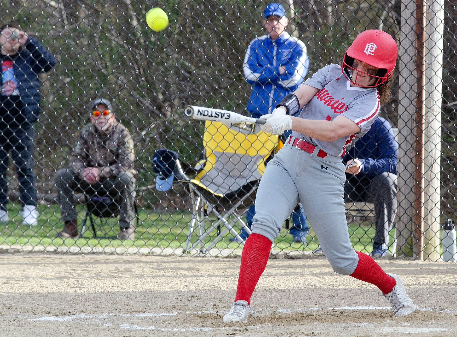 The Townies’ Sophie Patterson rips a base hit against the Spartans.