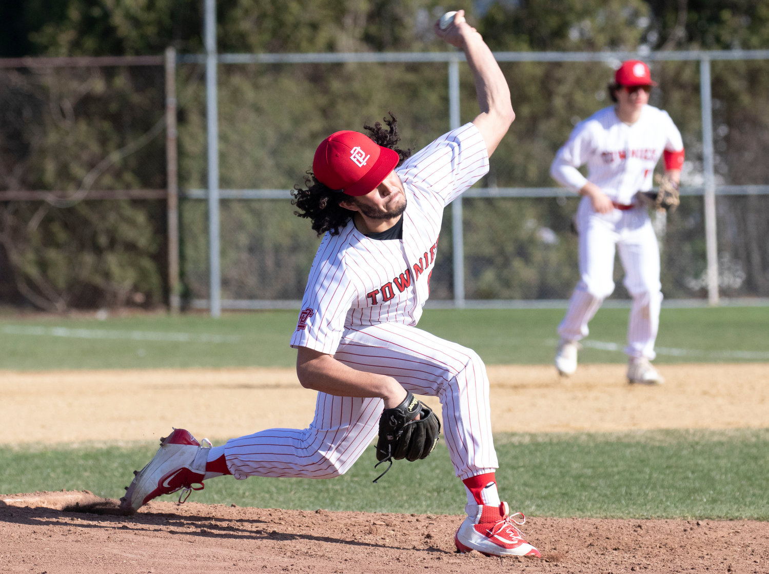 East Providence High School senior starter Elijah Barber delivers a pitch for the Townies in their 2022 Division I season opening contest against Portsmouth on Monday, April 4.