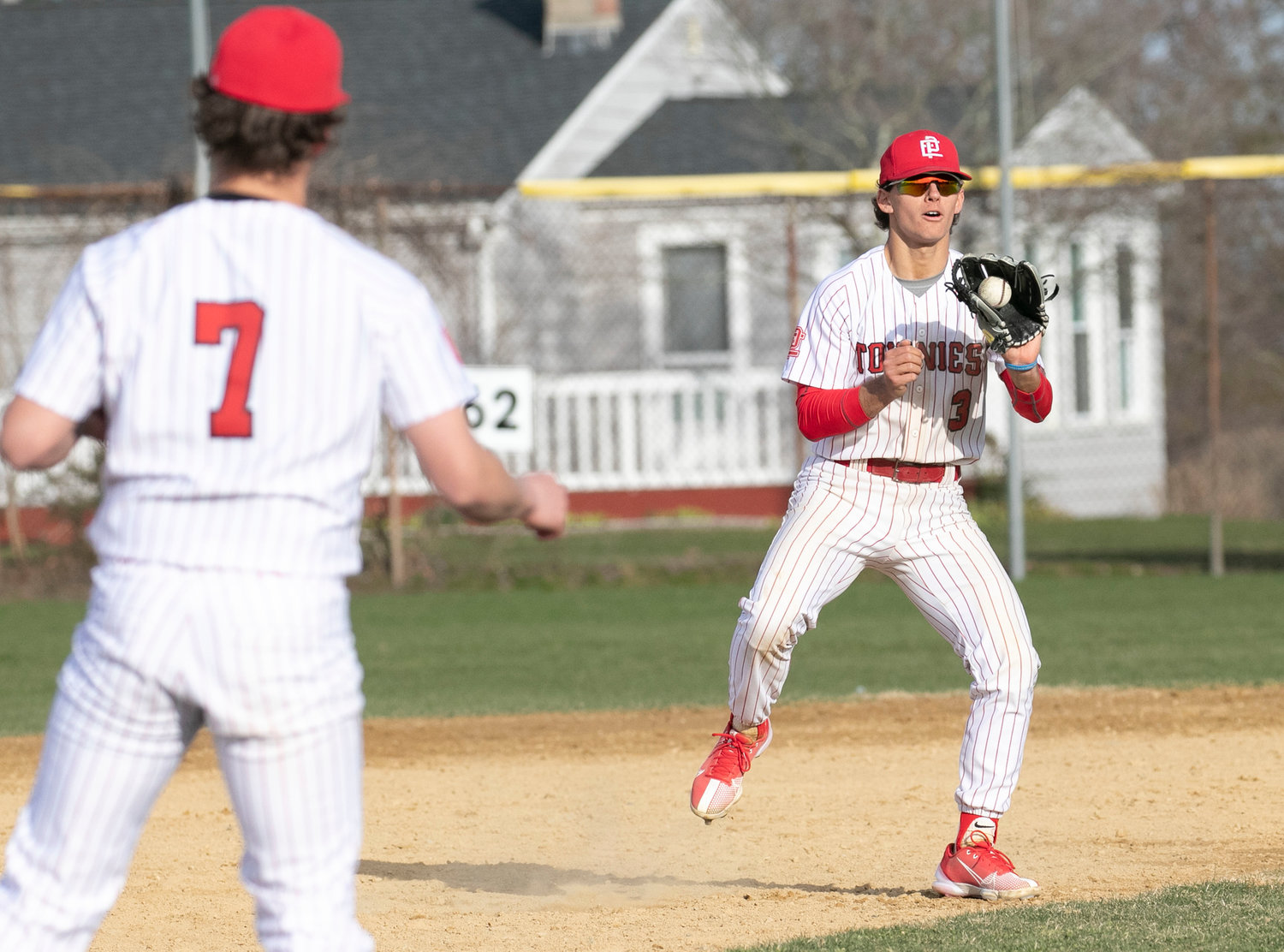 EPHS shortstop Jack McKnight and the Townies infield throw around the horn after a strikeout in their game last week at Portsmouth.