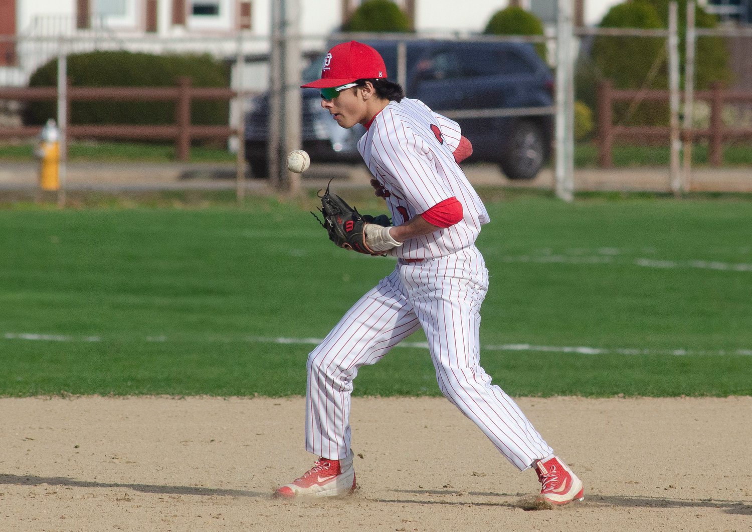 Second baseman Kyler Lorenz bobbles a sharp grounder allowing Barrington runners to advance to first and second.