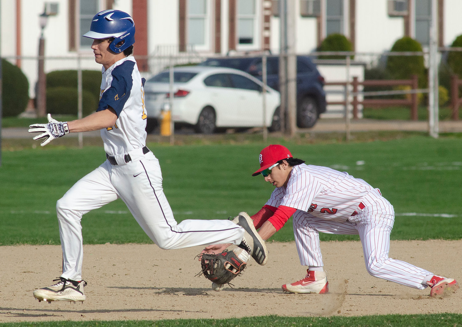 Barrington High School’s JC Neimeyer sprints past an East Providence infielder during the Eagles’ game on April 13.
