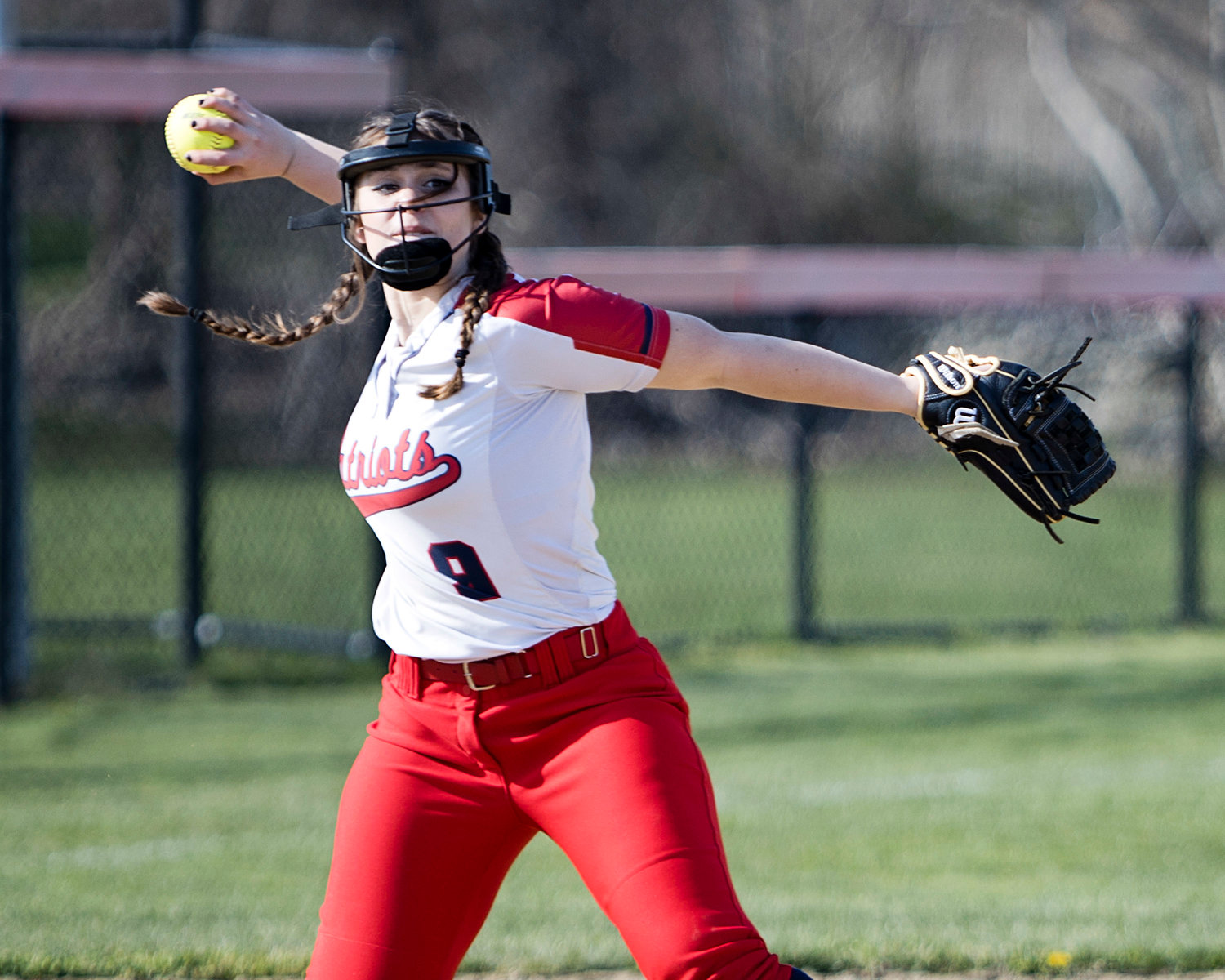 PHS third baseman Gabriella Pires throws to first for an out in the first half of the game.