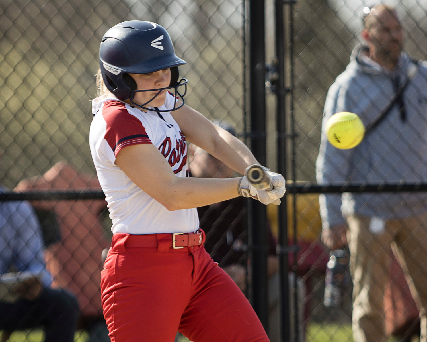 Patriots catcher Gracie Keyes makes contact during her at-bat. The junior hit a double in the sixth inning and had one RBI.