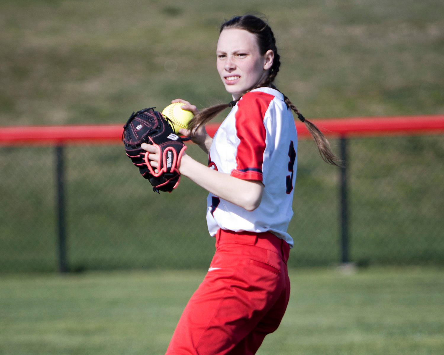 Karina Hopton throws the ball in from right field.