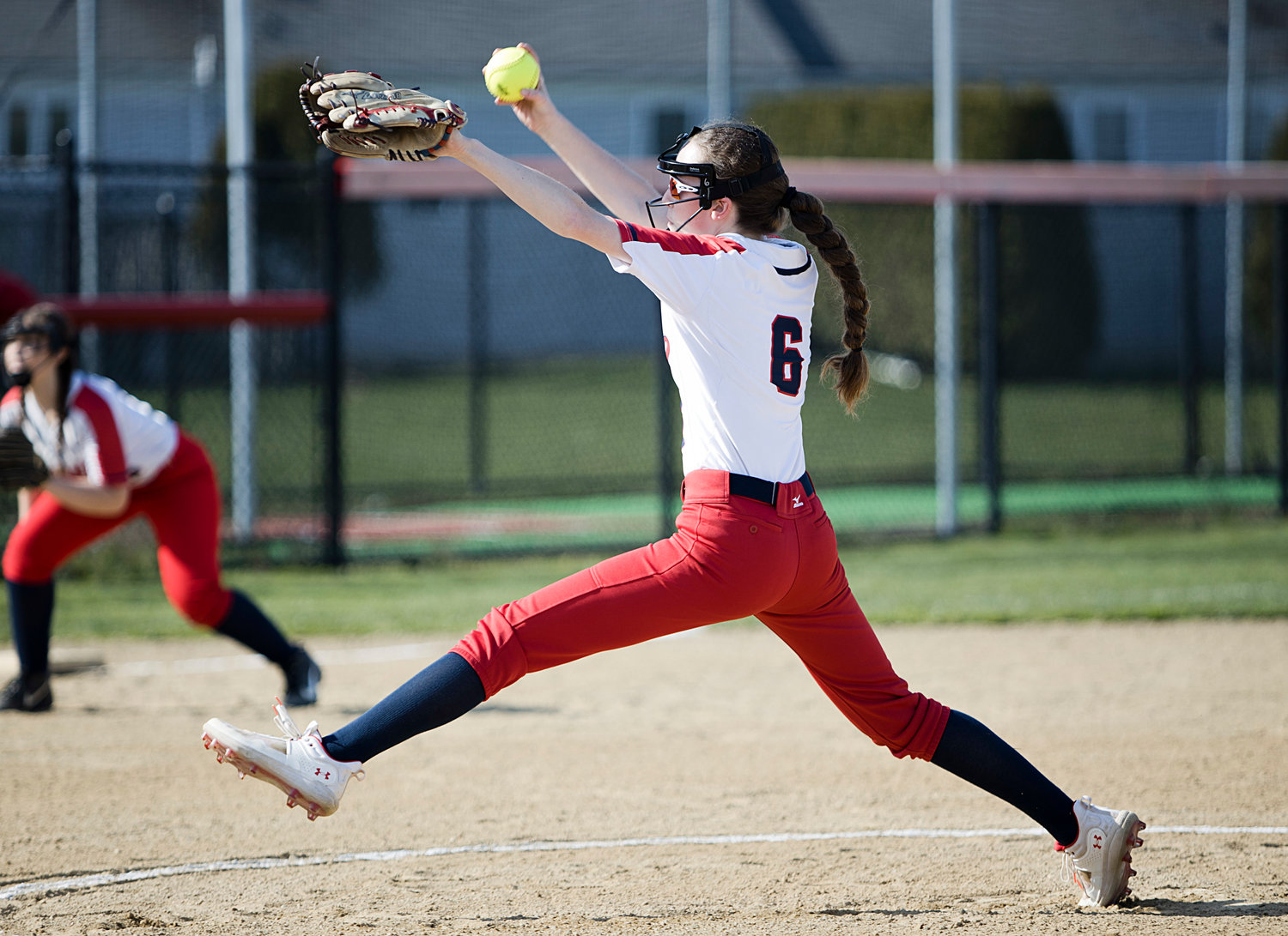 Pitcher Megan Malone fires a pitch to a batter during the first inning.