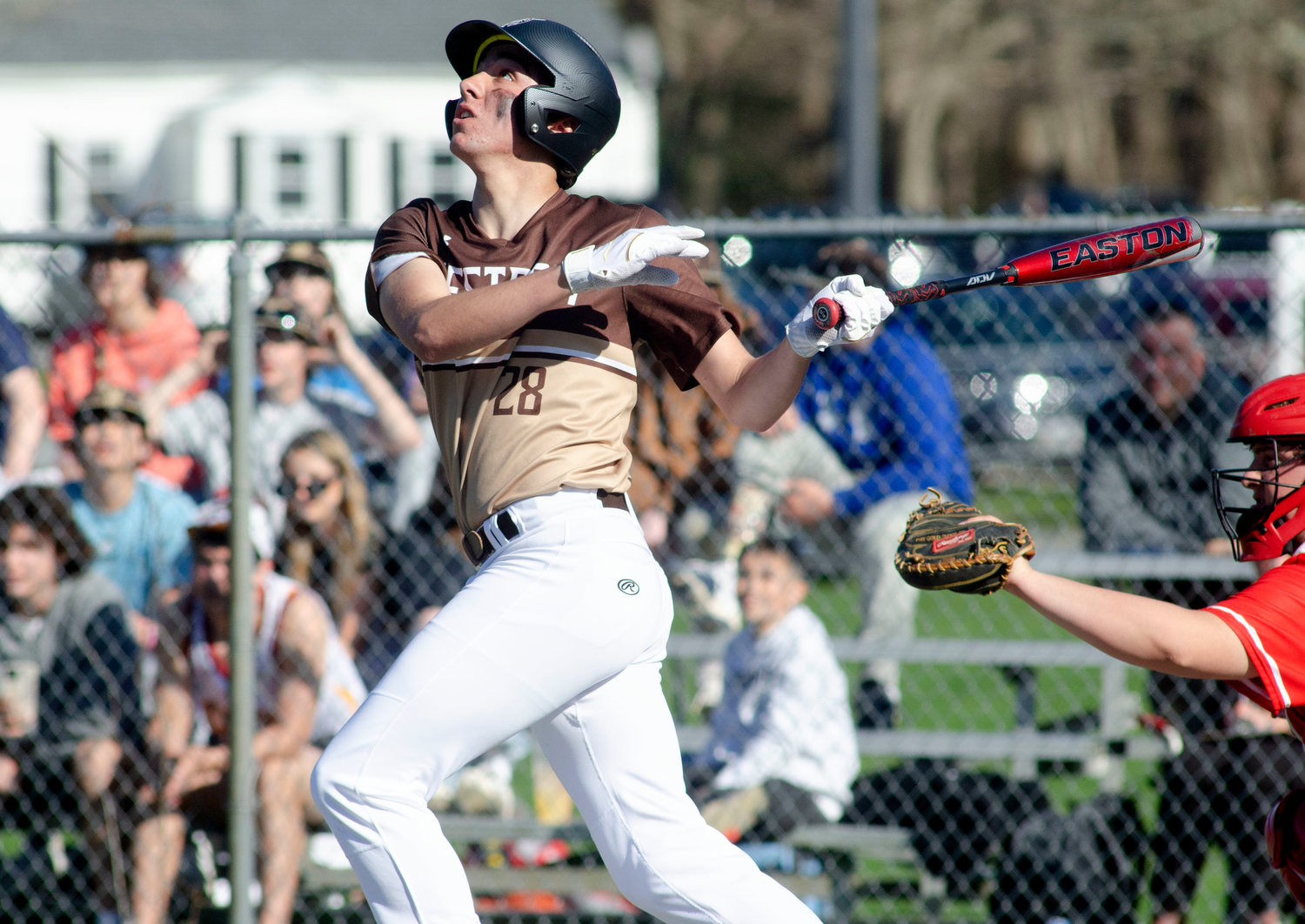 Max Morotti checks the flight of the ball as he follows through on his swing during Westport's game against Bishop Connolly last week. Morotti had a pair of hits and scored 2 runs in the game.