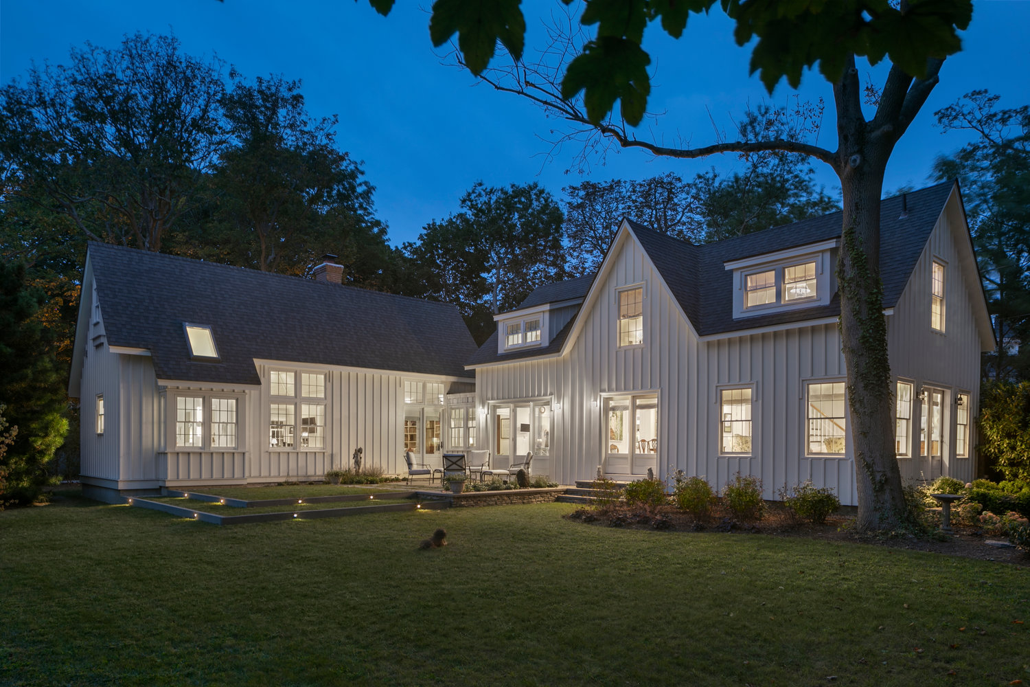 This renovated Newport property consists of an historic barn from the 1850s (right), connected to a new wing (left) that allowed an older couple to sell their grand main residence, subdivide their lot and retire to the cozy barn out back.