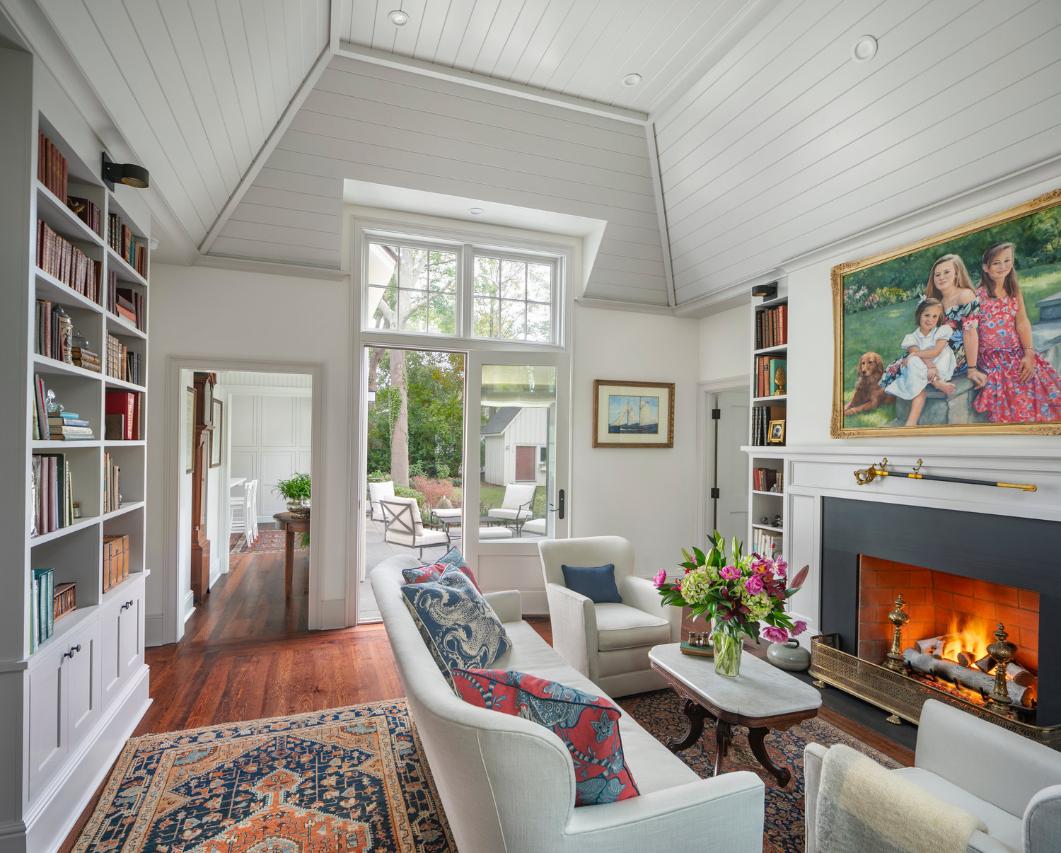 The newly constructed living room/library connects to the owners’ first-floor master suite and opens to the outdoor patio.