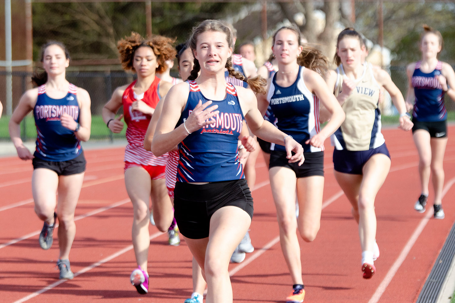 Portsmouth’s Addison Mau leads the pack during the start of the 1,500-meter run, which she’d go on to win in a time of 5:12.8.