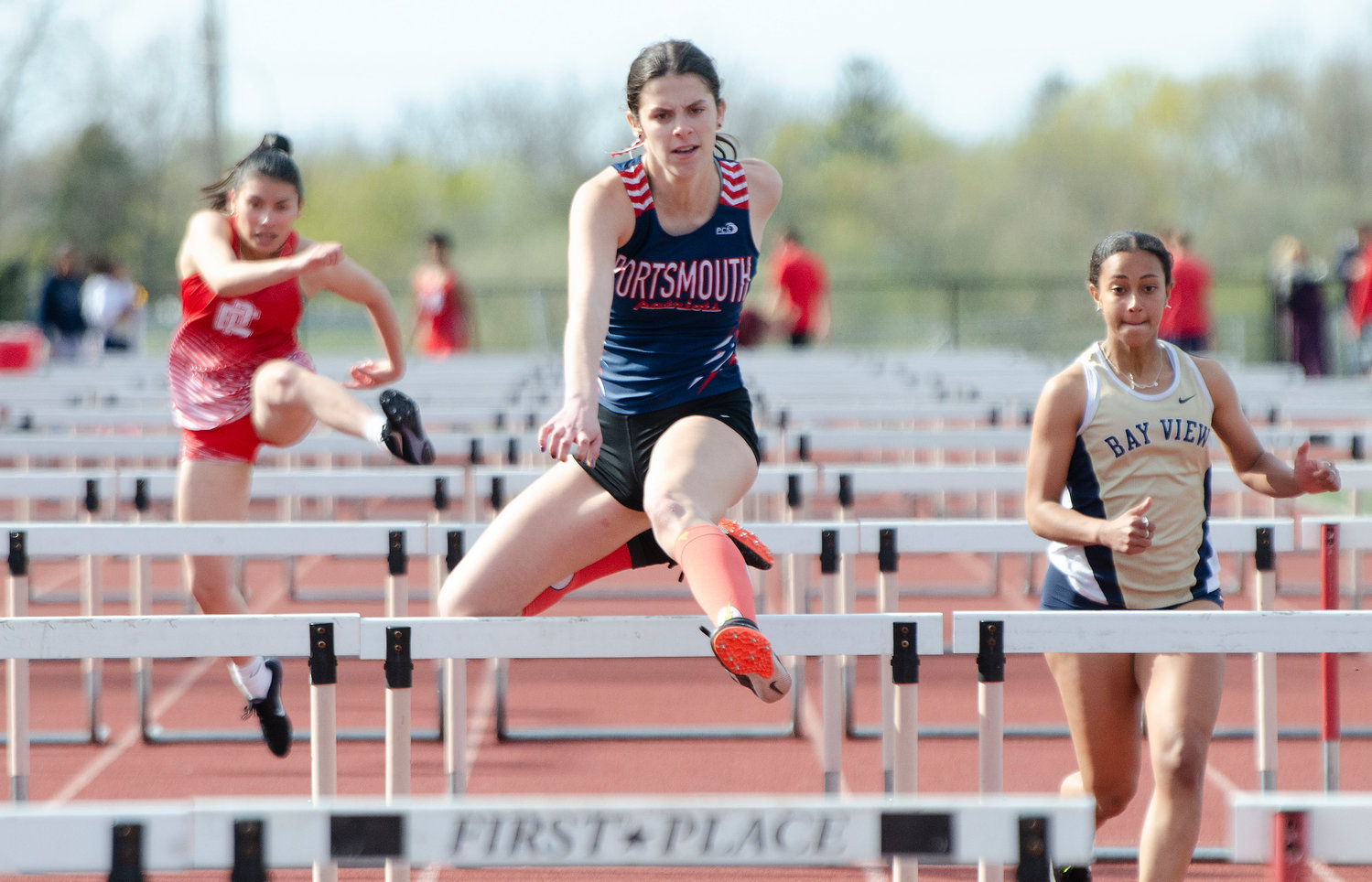 Katie Spaner skims over a hurdle during the 110-meter hurdles.