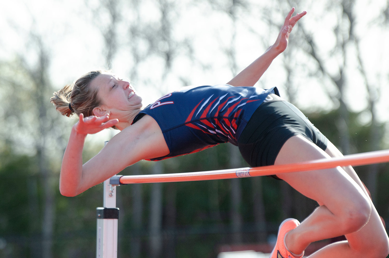 The Patriots’ Morgan Casey eases over the bar during the girls’ high jump, which she won with a best effort of 5 feet, 2 inches.