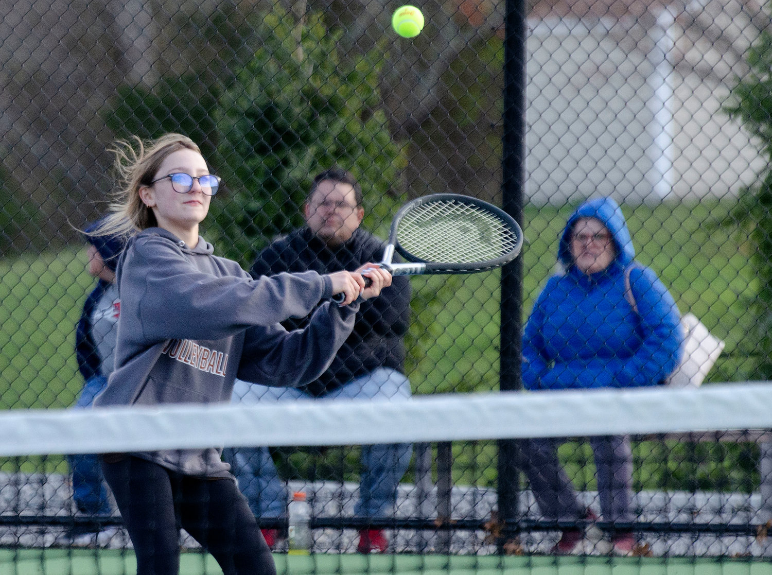 Ava Couto returns serve during the team's second doubles match.