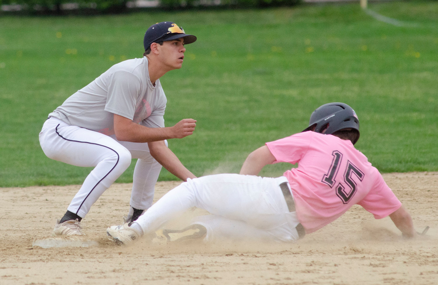 Barrington High School second baseman JT Celico makes a late tag on Huskies base-stealer Jack Standish.