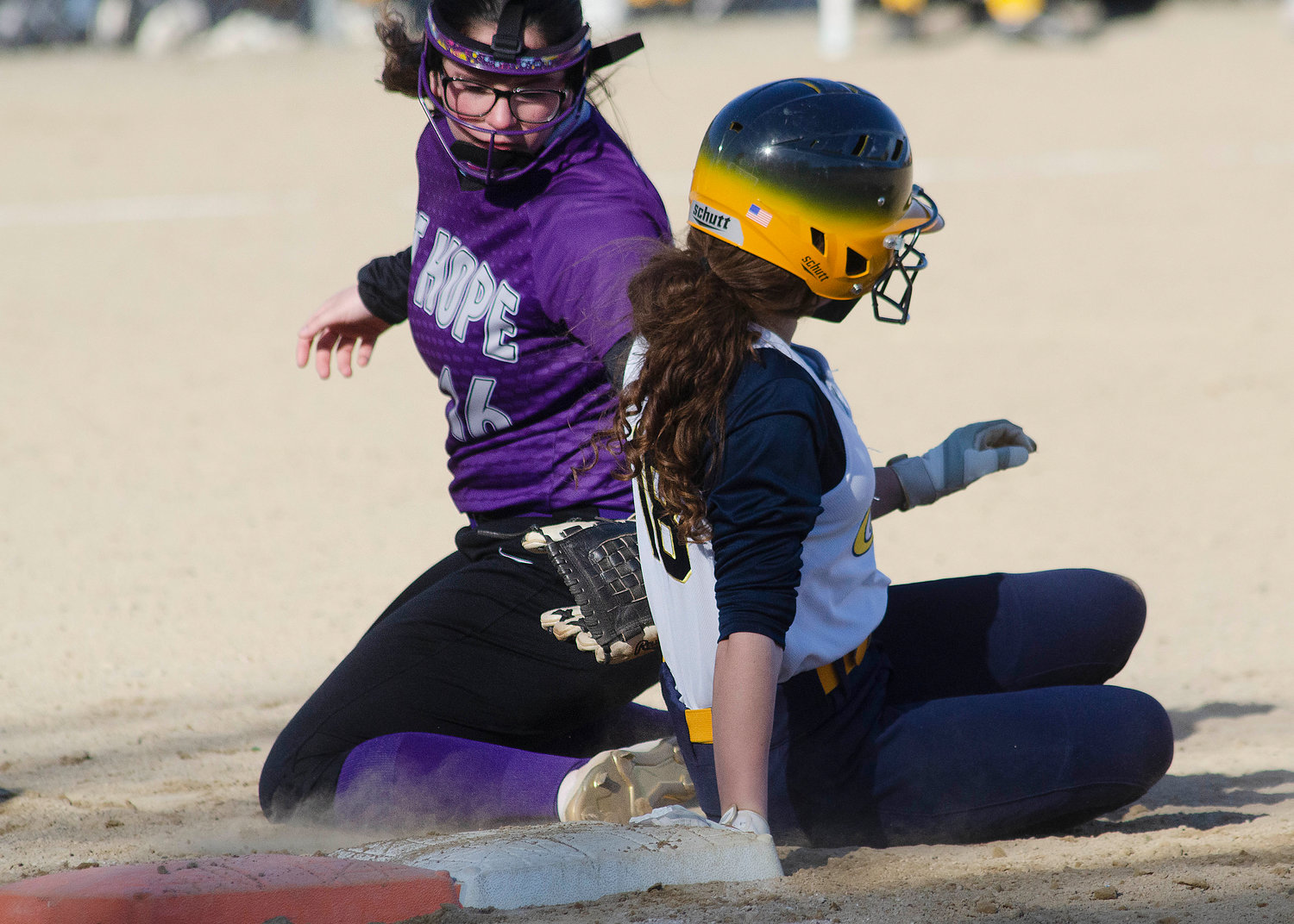 First baseman Sammy Malafronte slaps a tag on an Eagles baserunner after taking a throw from catcher Grace Stephenson who was attempting to pick the runner off.