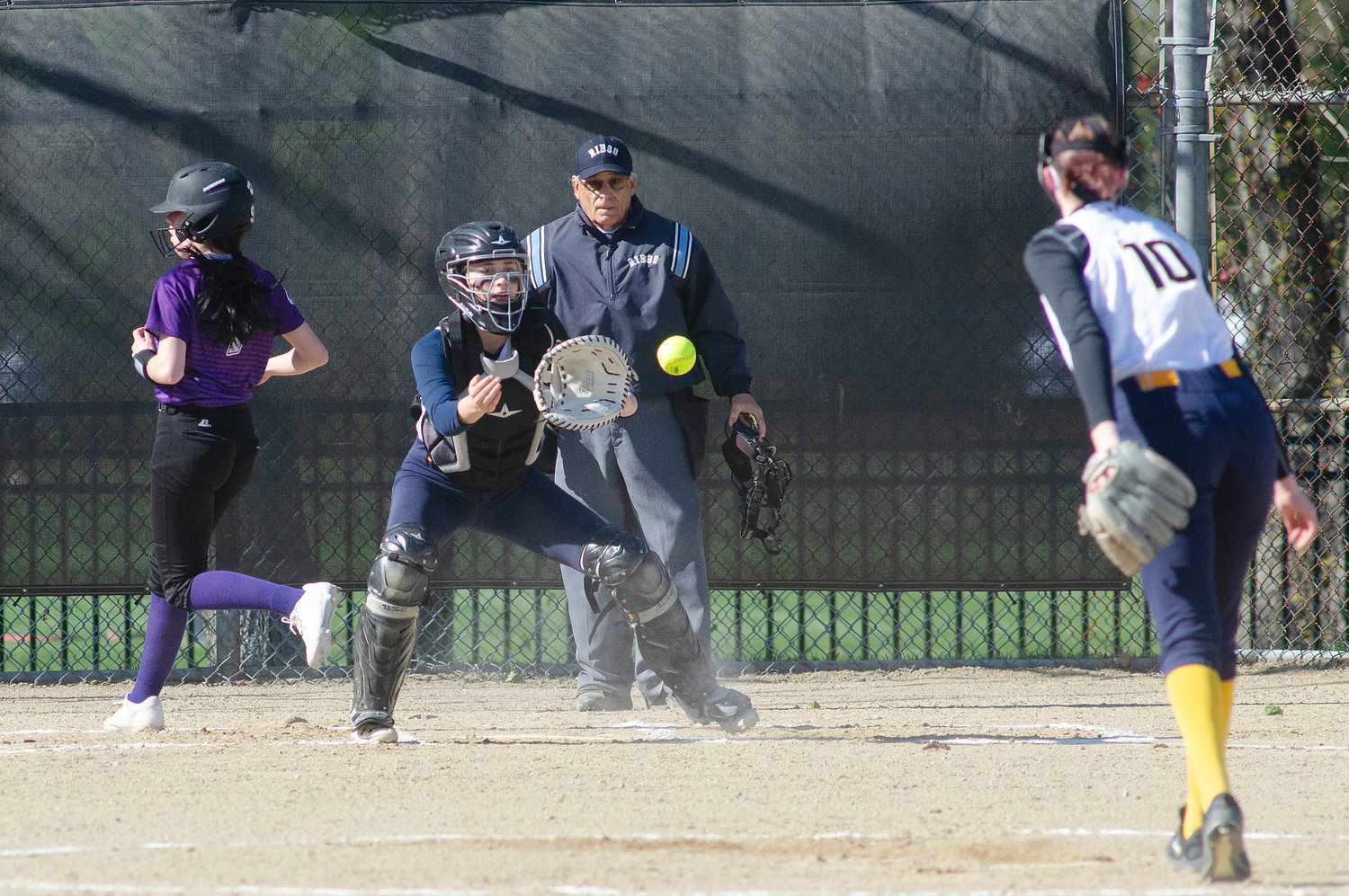 Eagles catcher Ruby Ciummo takes a late throw from pitcher Ace McCoy (right) as a Mt. Hope runner crosses the plate.