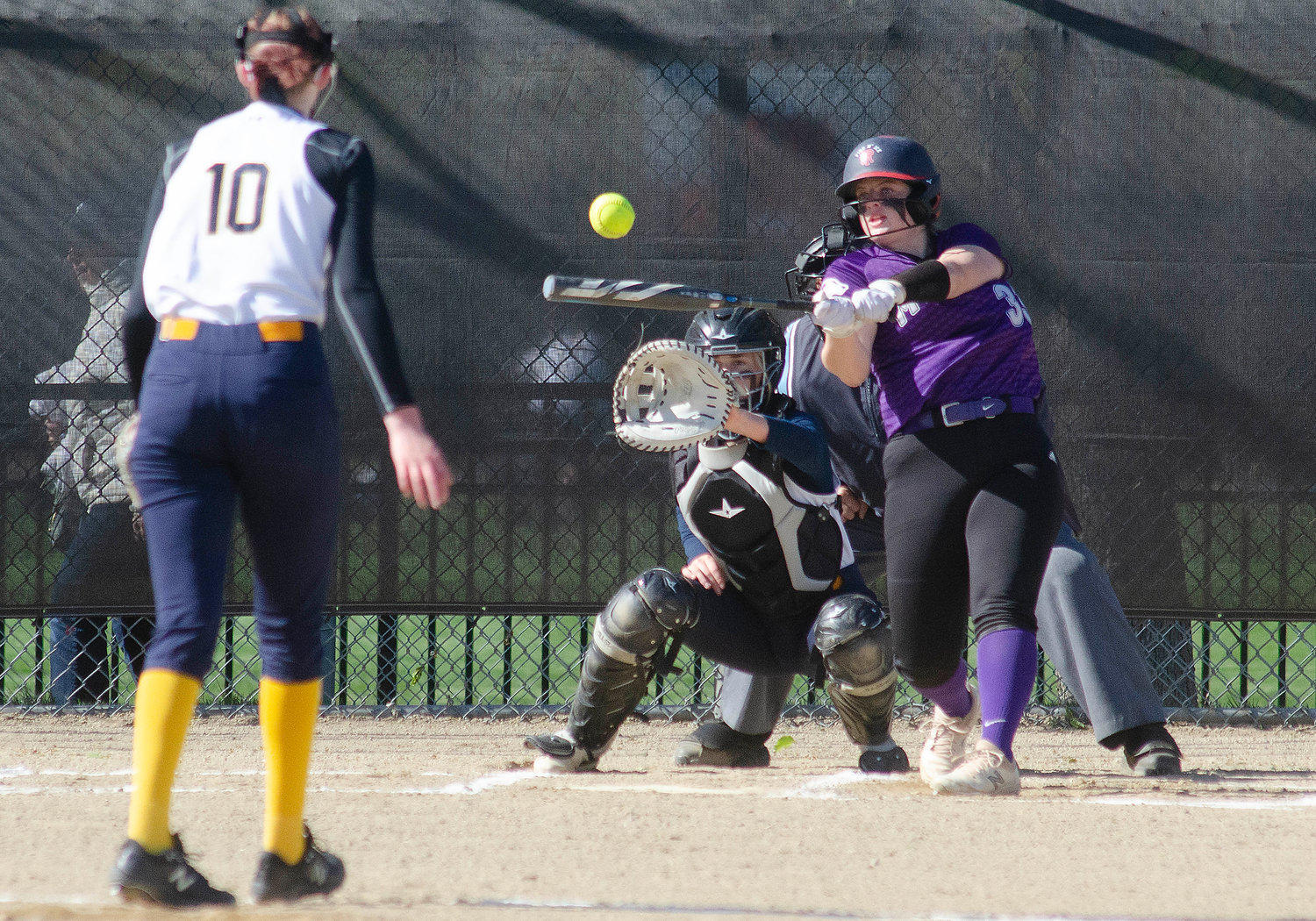 Clean up hitter Grace Stephenson smacks one of her four hits during the Huskies 23-3 win at Barrington on Monday. Stephenson scored three runs and drove in two runs.