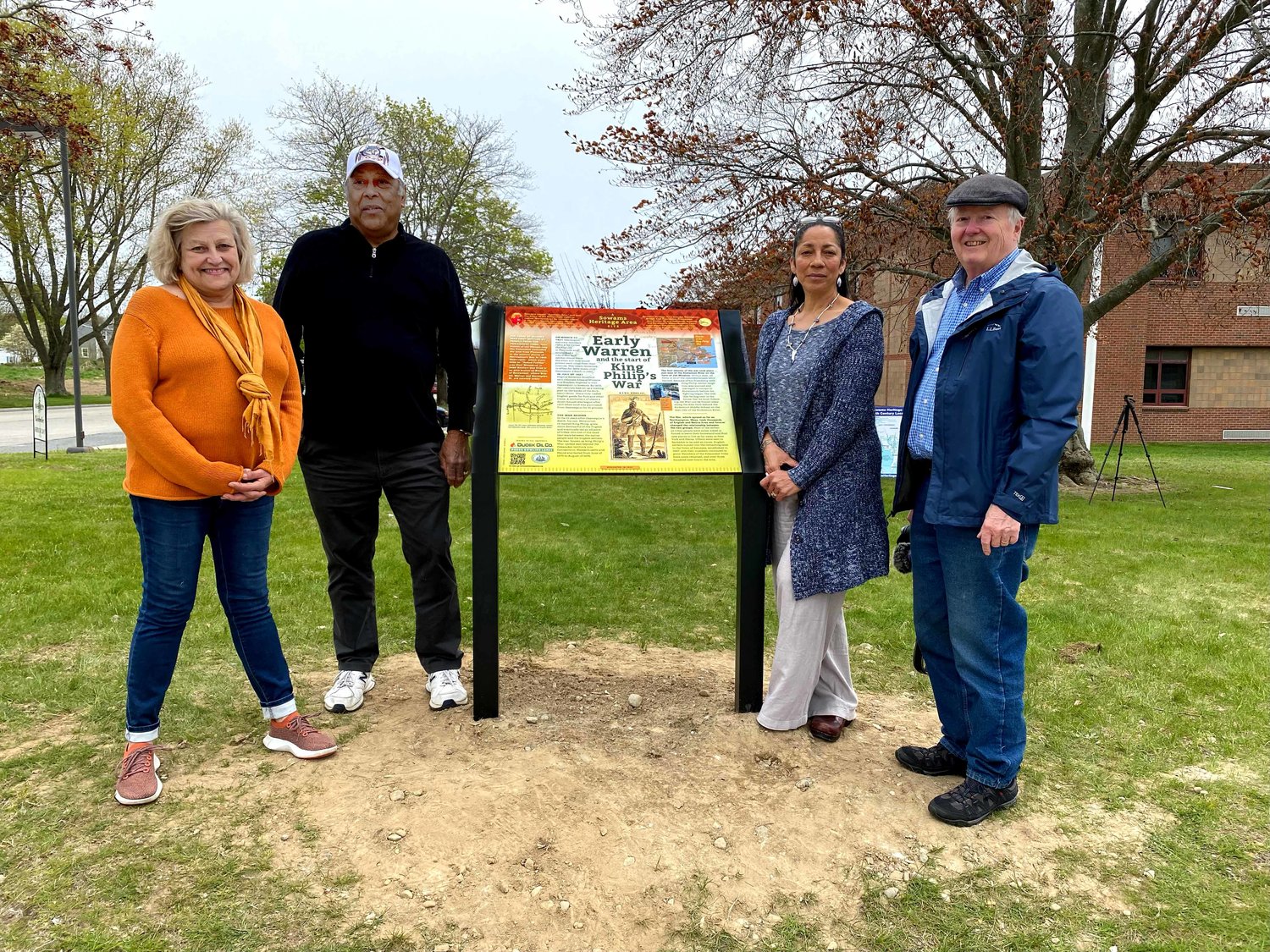 Marker designer Karen Dionne, Pokanoket Sagamore William Guy and Sachem Tracey Brown, and Sowams Heritage Area Project Coordinator David Weed pose for a photo with the newly installed marker.
