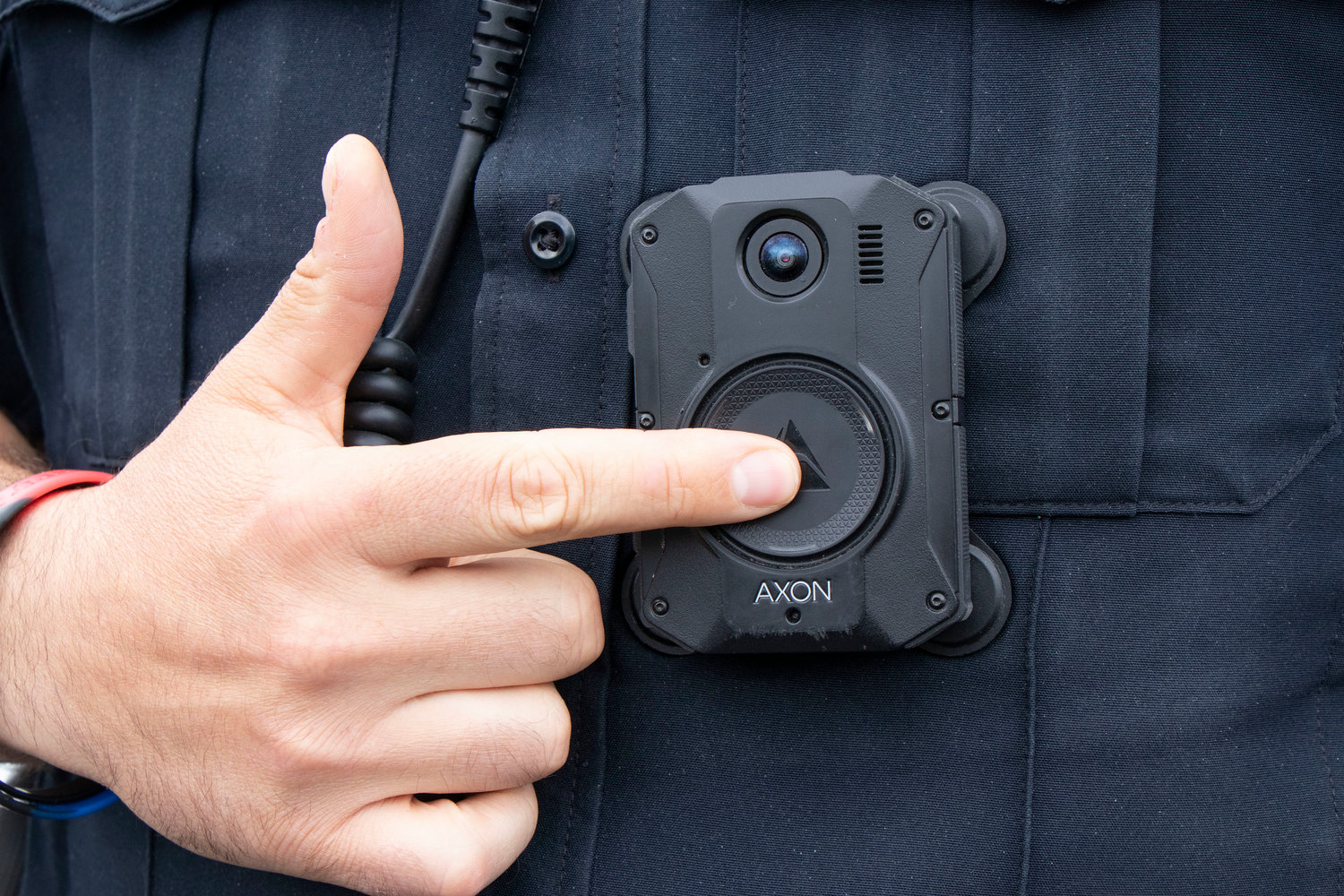 The body cameras are activated with the touch a button on the front.