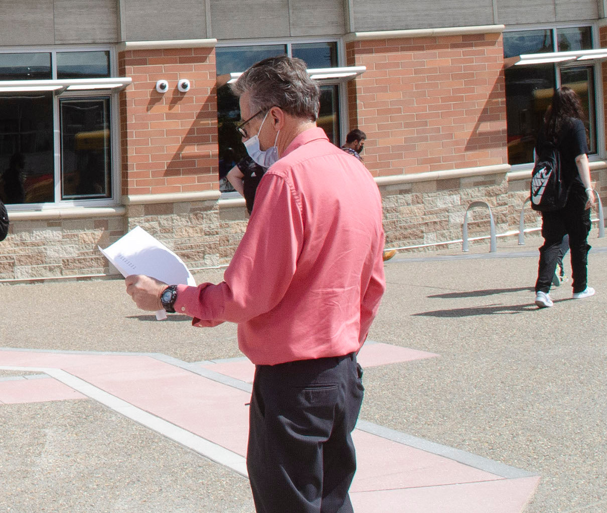 Assistant principal Bob Currier checks the bus list at the end of the first day of classes at the new EPHS late last summer. Currier is retiring at the conclusion of the 2021-22 term after 28 years in the district.
