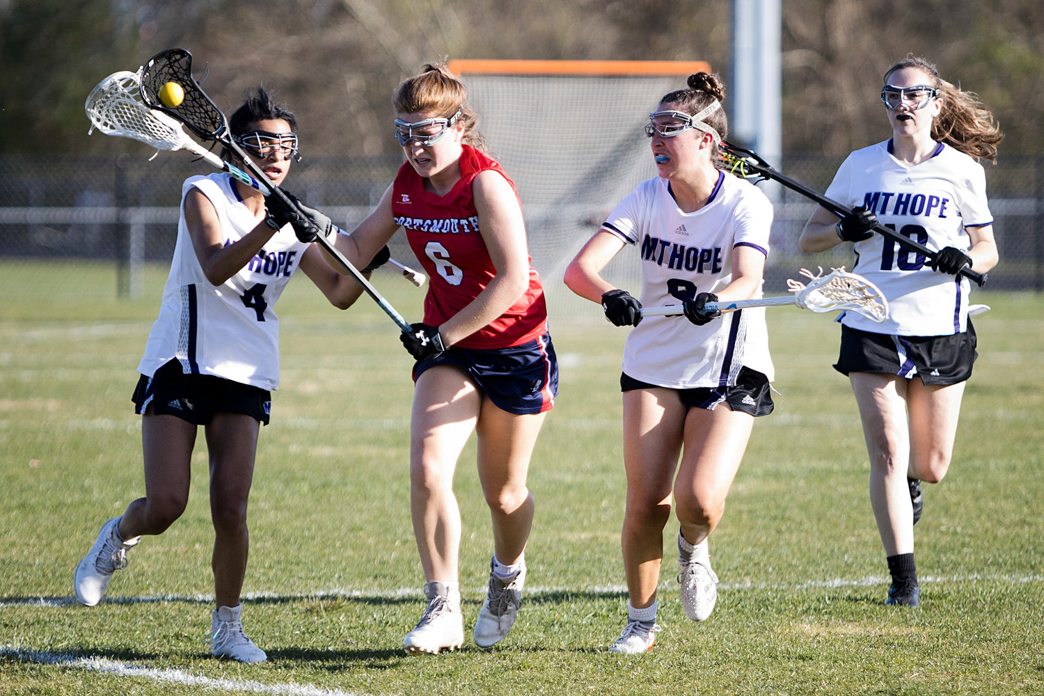 Emilie Bobola squeezes through a trio of Mt. Hope opponents while advancing the ball toward the goal.