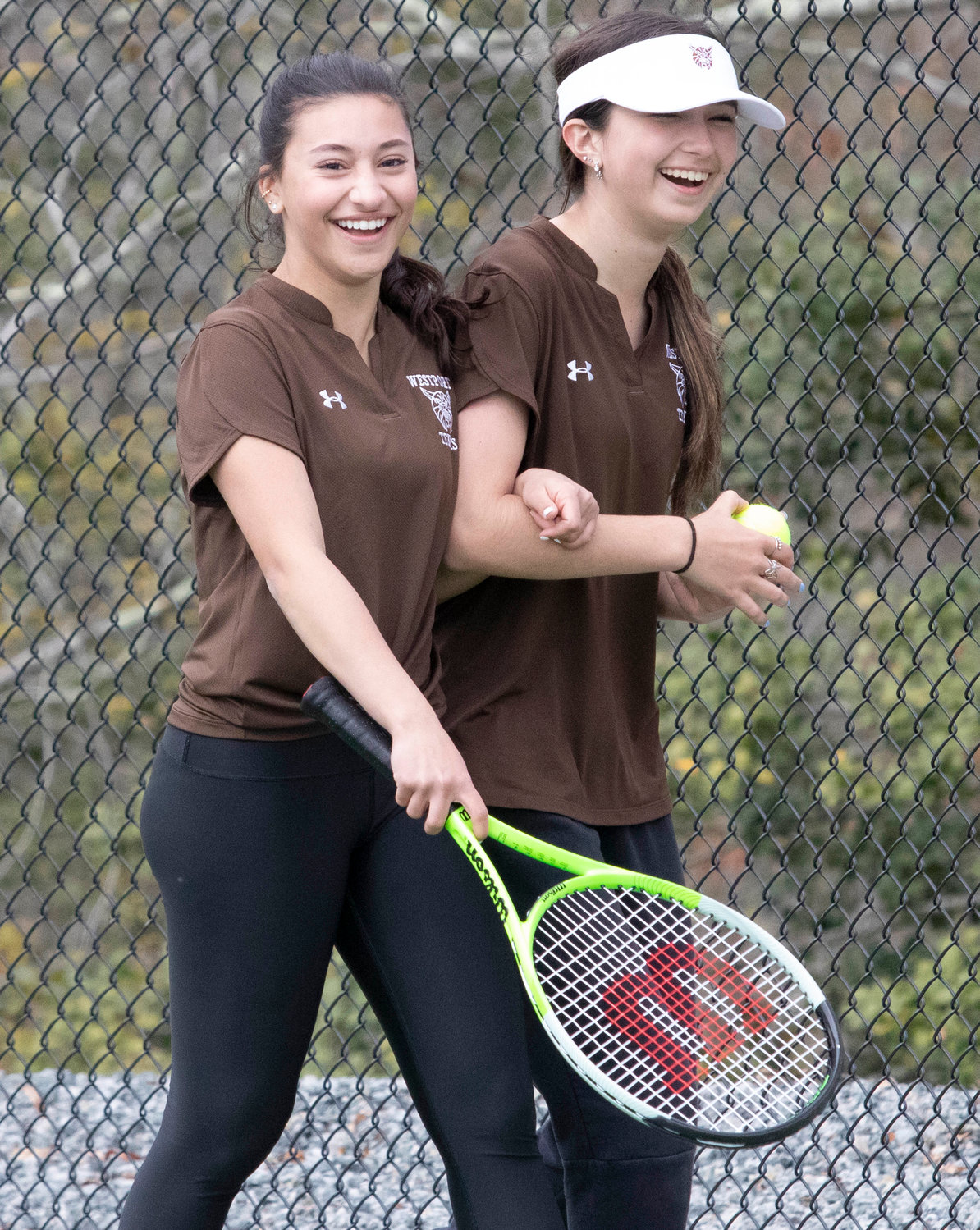 Second doubles team Avery Carvalho (left) and Madison Plourde lost their match to Diman’s Olivia DeMelo and Kaydence Simoes 6-1, 6-7(5-7) and 6-7(5-7). The team shared a laughed when Plourde hit Carvalho who stood at the net, with a forehand during the match.