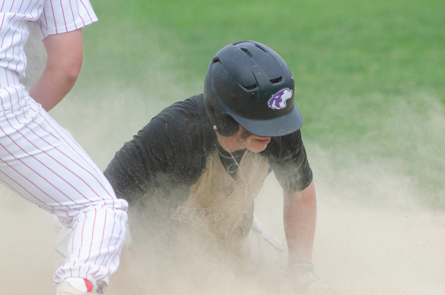 First baseman Matt Gale rounds second base after smashing a towering hit to right field for a triple to start off the bottom of the seventh inning with the Huskies down 9-8. Gale looked to head coach Mike Mazzarella as he rounded second base and slid into third base safely.