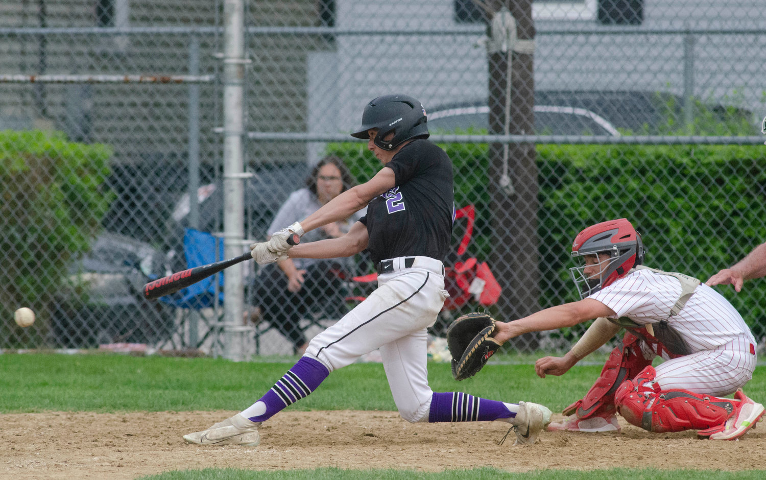 Senior centerfielder Aidan Ramaglia places a ground ball base hit into centerfield to plate to Huskies runs and give Mt. Hope a 10-9 victory over East Providence.