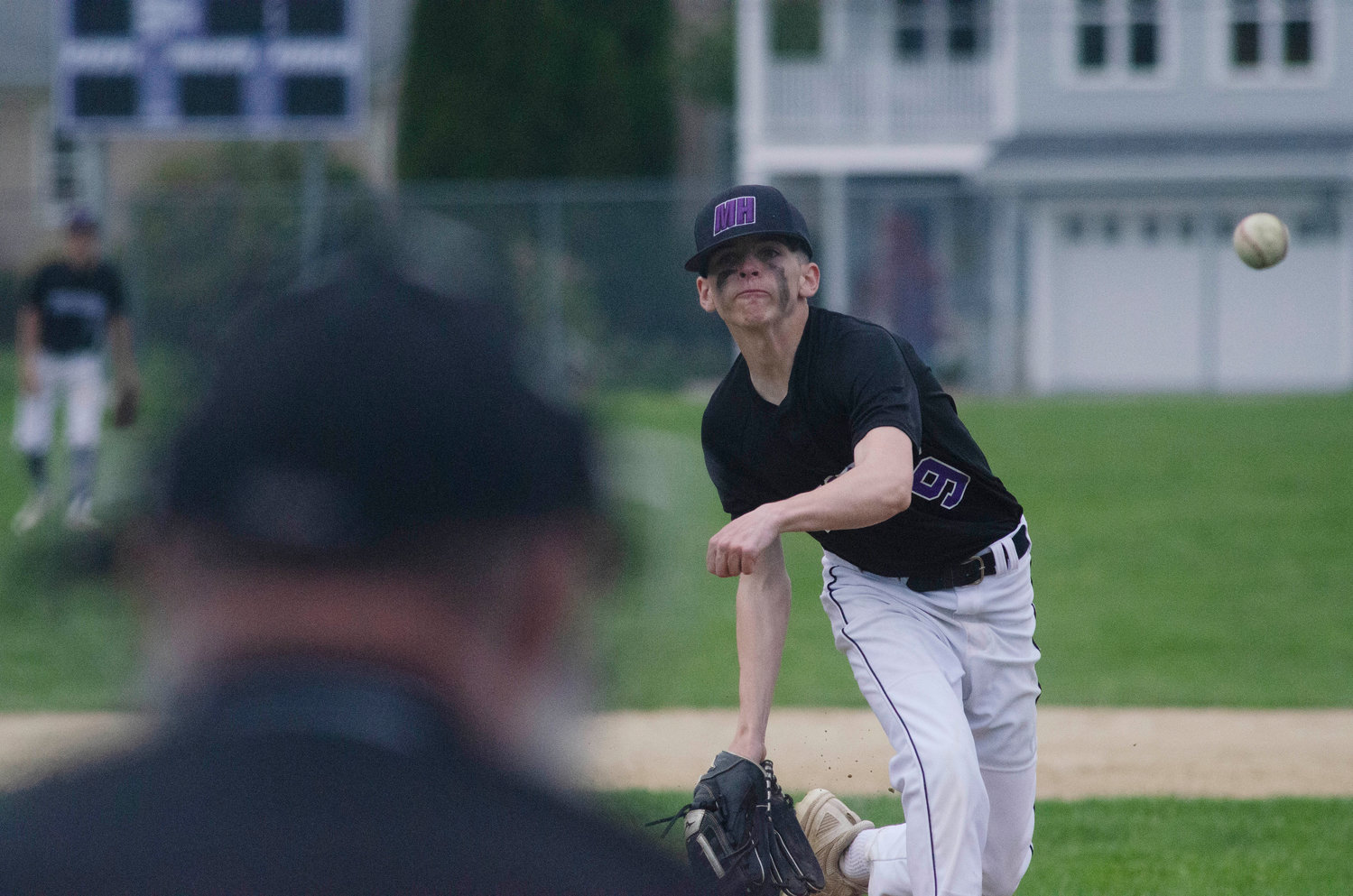 Freshman pitcher Ethan Santerre throws a side arm pitch during the game in the top of the seventh inning. Santerre struck out four and gave up five runs in two innings.