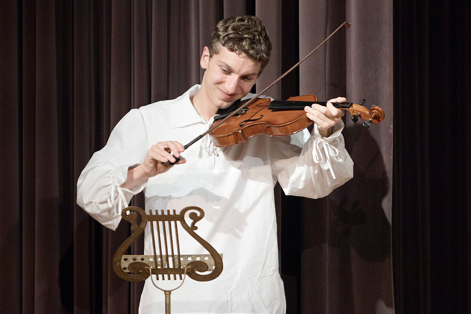 Matthew Catani plays the fiddle while rehearsing the "Party Scene" of the BHS Stagemaster's Spring play "Sleepy Hollow: Ichabod and the Headless Horseman.”