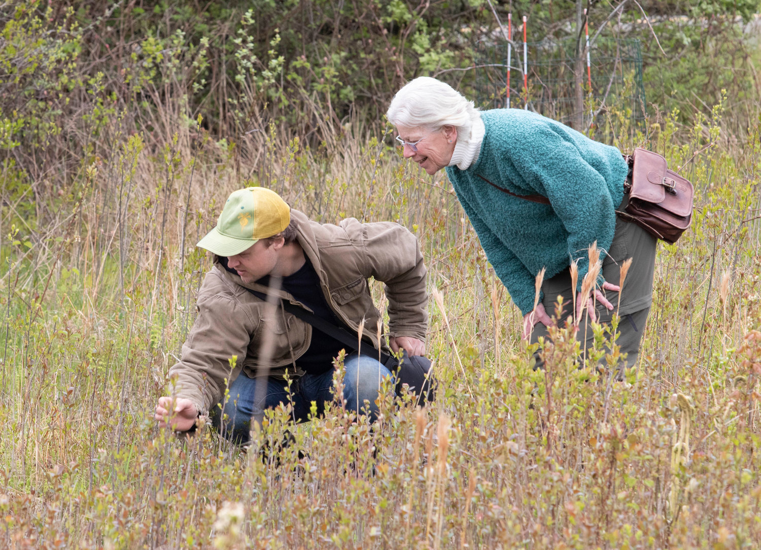 Gary Plunkett, of the Tiverton Open Space Commission, talks about native species with Sue Theriault of the Little Compton Tree Committee.