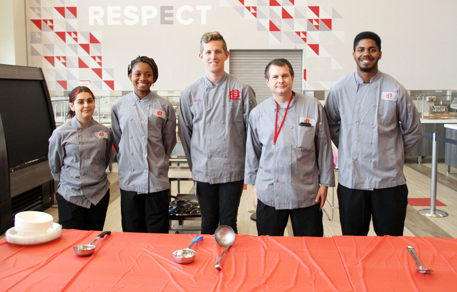 East Providence High School Career and Technical Center Chef Bill Walker (second from right) was honored for his efforts in the Culinary Department and also helped prepare the fare at the annual EPLAC Recognition Ceremony last week in the new EPHS cafeteria. Students and staff (from left to right) Raquel Salvador, Nazarae Phillip, Chef Will Walbank and Aaron Hosley also prepared food for the evening as did Chef Marie-Claire McKillip (not pictured).