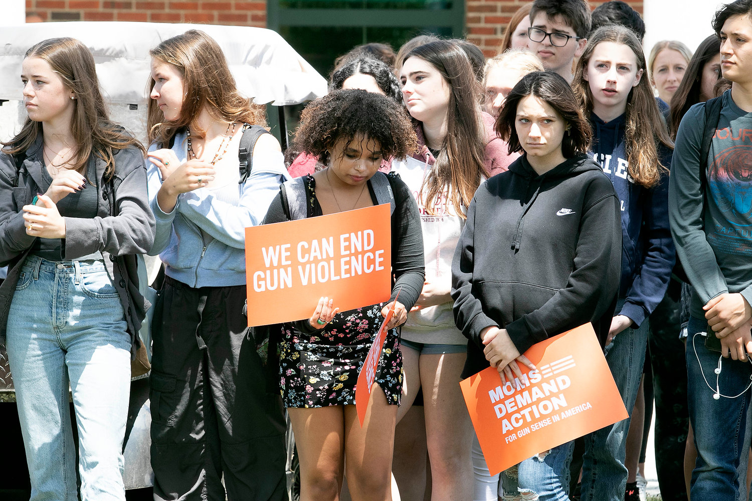 Students hold signs during a rally against gun violence at the high school on Thursday.