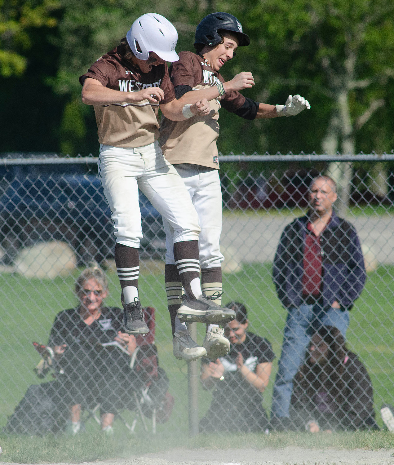 Noah Sowle and Ben Boudria celebrate after scoring in the third inning.