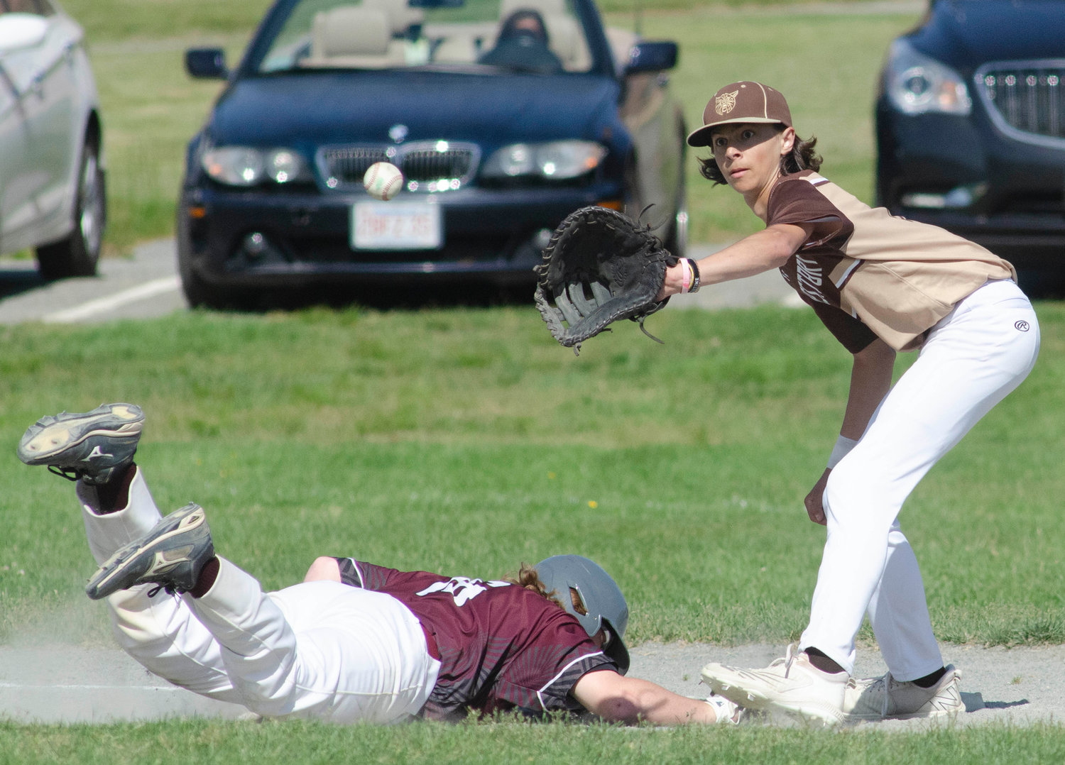 First baseman Luke Finglas catches a Max Morotti pick off attempt.