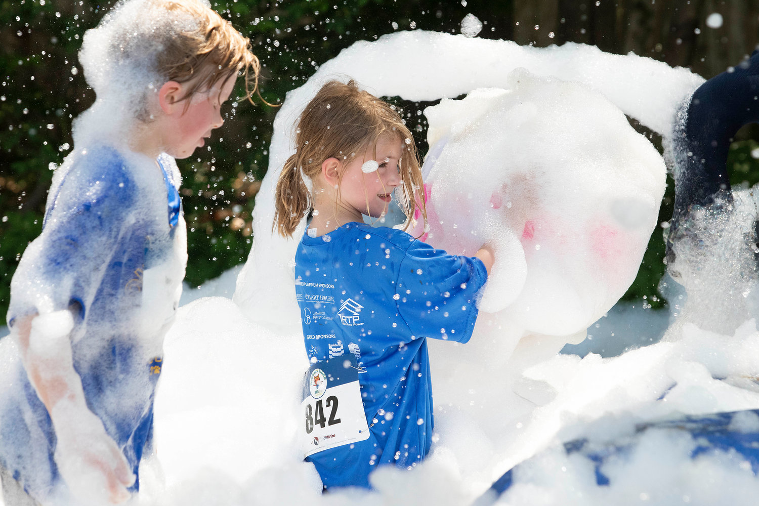 A Tough Tiger competitor plays in the bubbles near the finish of this year’s race.