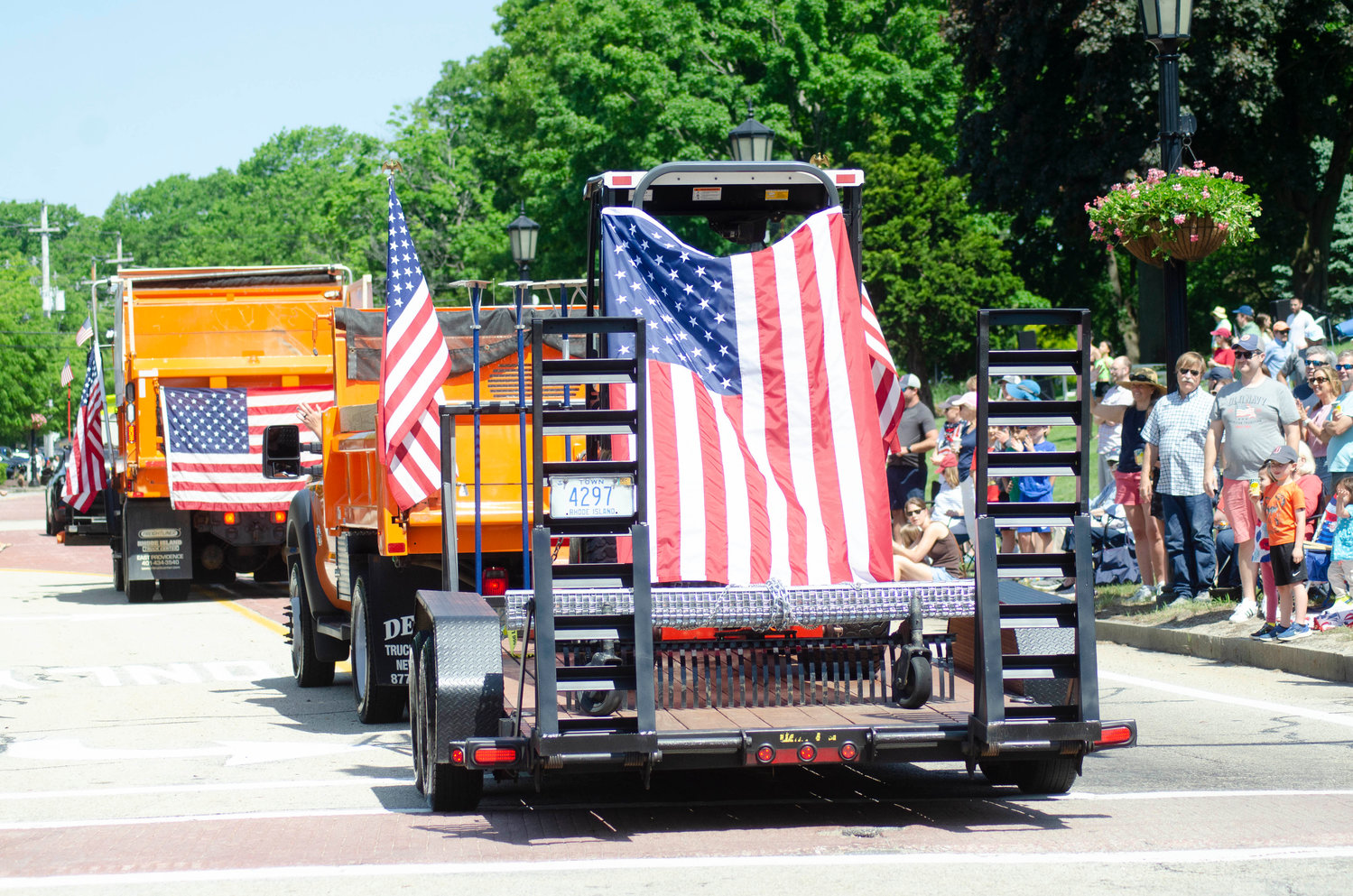 Barrington DPW trucks display American flags while driving along the parade route during a previous Memorial Day Parade.